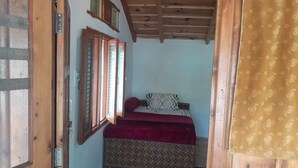 A room with a bed, a window, and a door. - Homely Hills,6Km frm Nagtibba trek route (Mayani)