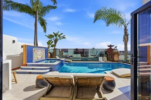 A pool area with lounge chairs, a tiled deck, and palm trees. - Historic Sunset Strip Suite w/ Pool & Jacuzzi (Los Angeles)