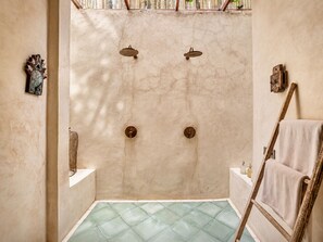 A bathroom with a tiled floor, a wooden ladder, and a towel rack. - Stylish 3BR Mediterranean Sanctuary in Uluwatu (Pecatu)