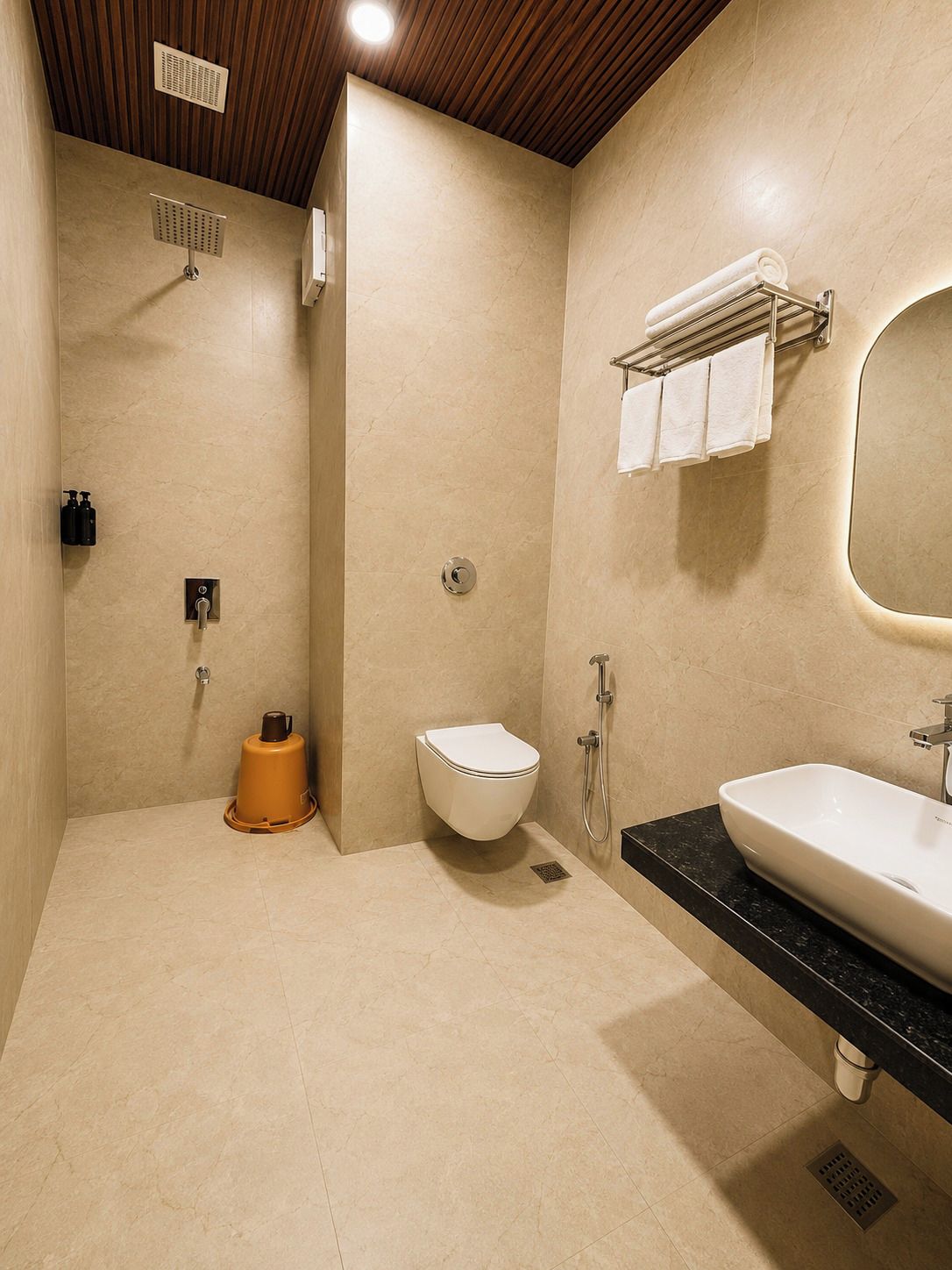 A modern bathroom with a toilet, bidet, and sink.