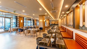 A modern restaurant with a long counter, multiple tables, and a view of the outdoors. - Çenger Blue Collection All Inclusive (Manavgat)