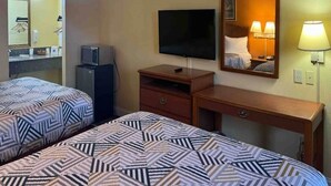 A hotel room with two beds, a television, a desk, a mirror, and a lamp. - 2 Queen Beds|Non-Smoking,Micfridge (Morrilton)