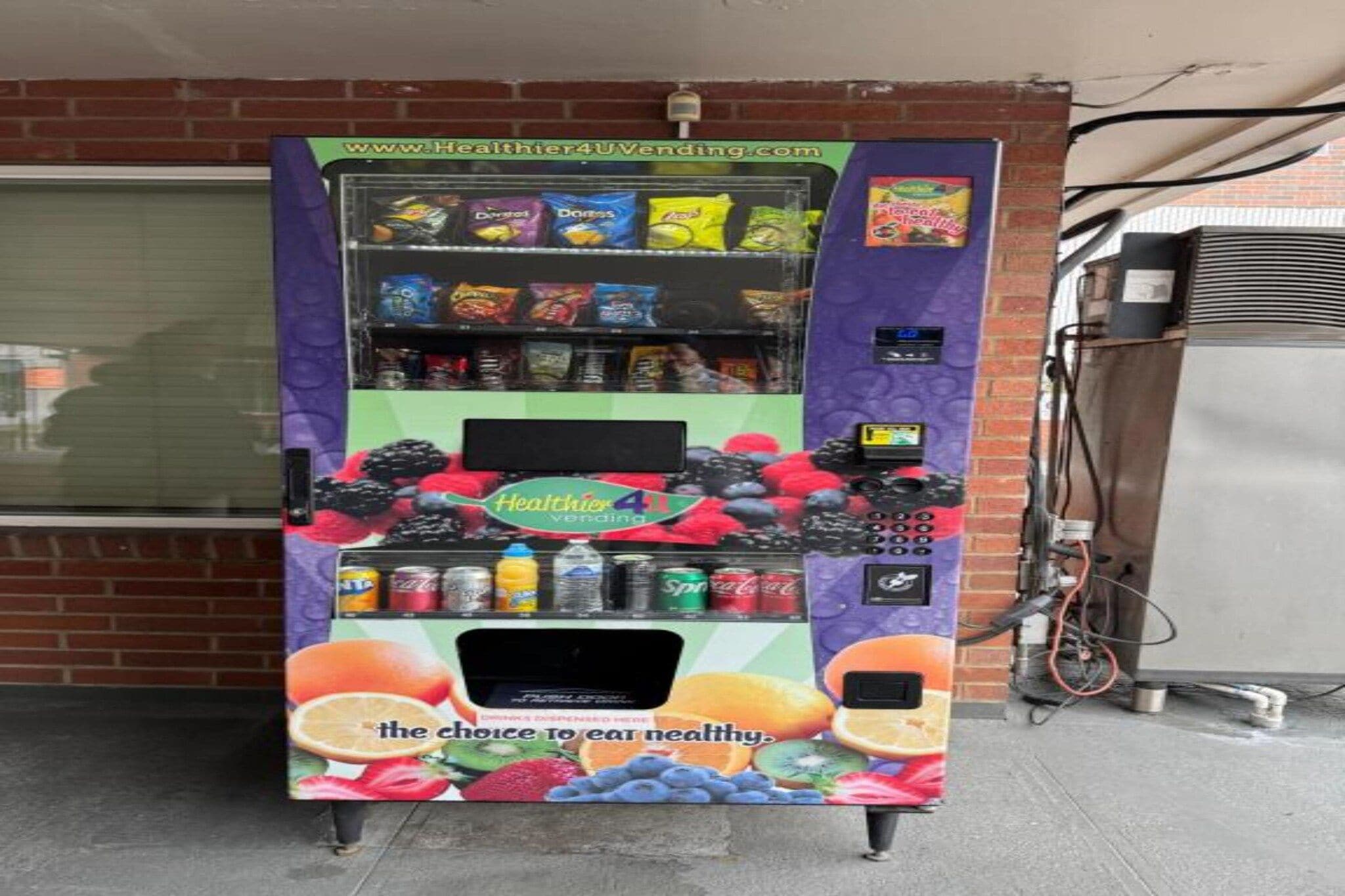 A vending machine with a variety of snacks and drinks, including Doritos and Coca-Cola.