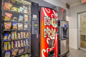 Two vending machines, one with snacks and the other with beverages. - 1 King Bed | Mobil Access Tub Nsmk Kitchen (Groves)