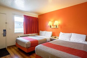 A hotel room with two beds, a window with curtains, a wall-mounted lamp, and a phone on the nightstand. - 2 Full Beds | Prescott (Prescott)