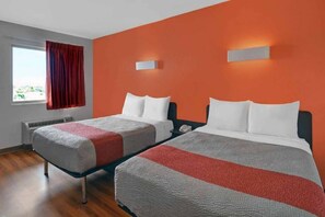 A hotel room with two beds, a window with curtains, and a wall-mounted light fixture. - Clean 2-Bed ADA|Pool|Free Parking (Cutler Bay)