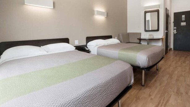 A hotel room with two beds, a desk, and a chair. - 2 Queen Beds|Hearing Accessible,Kitchen (Corpus Christi TX)