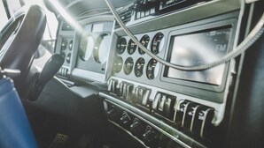 A vintage car's dashboard with a steering wheel, speedometer, and various gauges. - 1 Queen Bed | Micfridge (Flaggstaff)