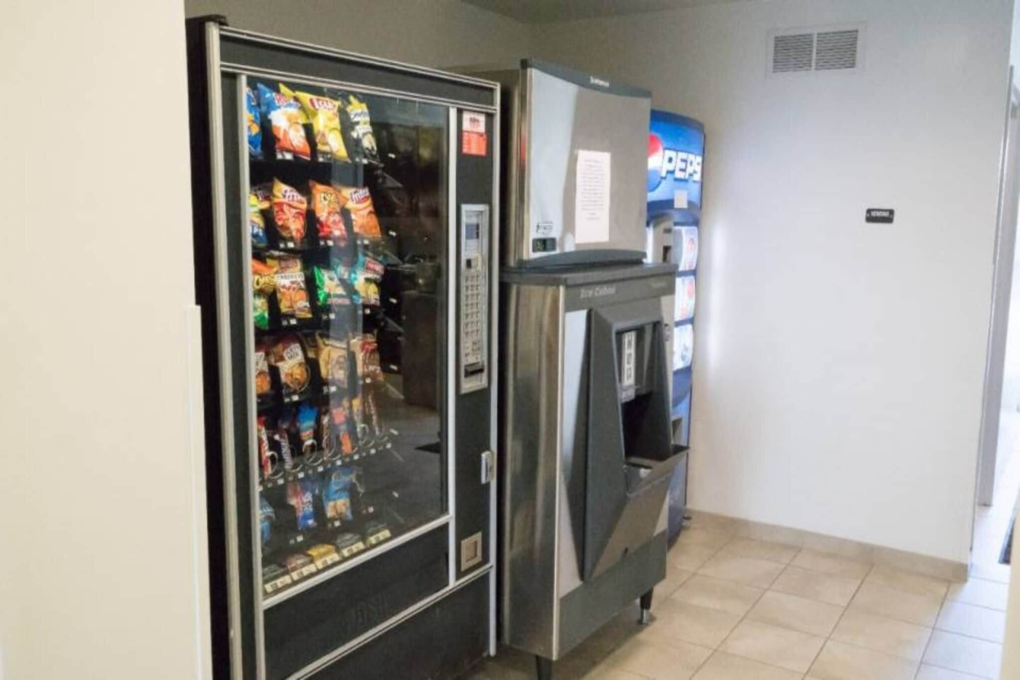 A vending machine with snacks and a drink dispenser.