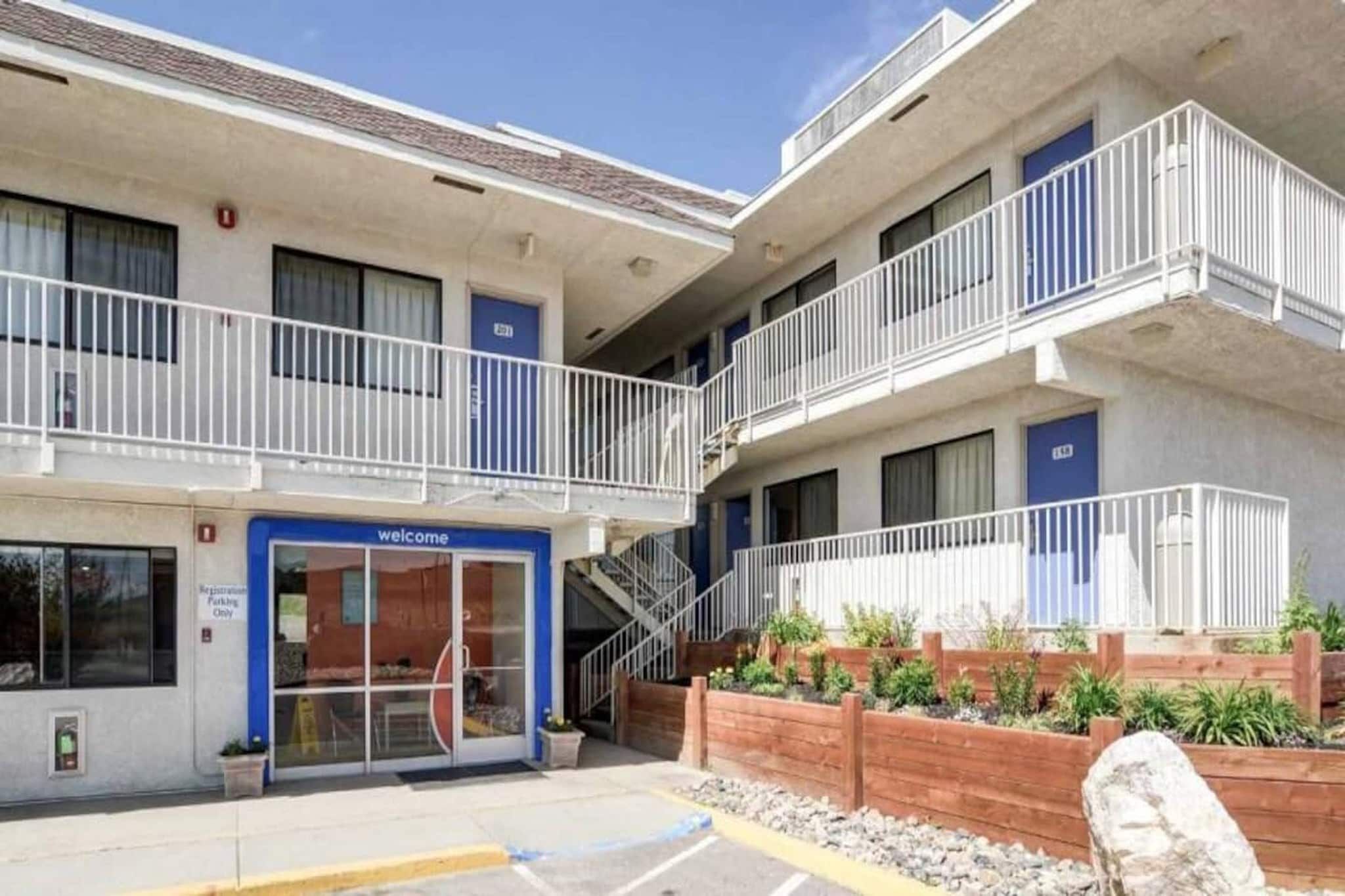 A multi-story building with a ground-level entrance marked 'Welcome.'