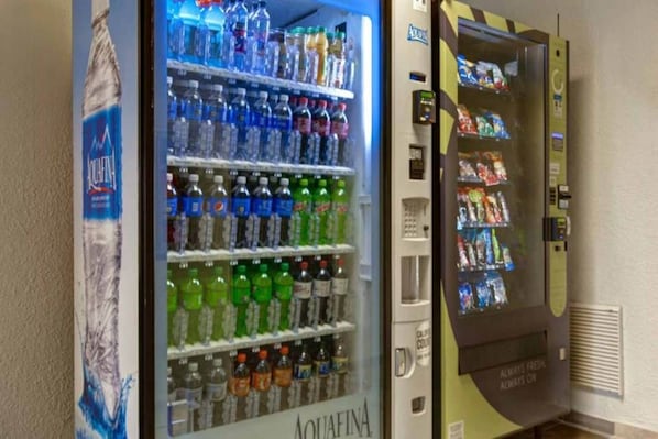 A vending machine with a variety of beverages and snacks. - 2 Full Beds | Non-Smoking, Kitchen (Jacksonville)