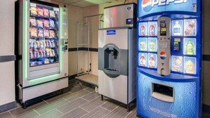 A vending machine area with a Pepsi machine and a snack vending machine.