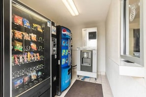 A vending area with snack and drink options, including a Pepsi machine.