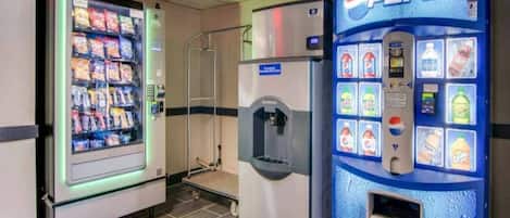 A vending machine area with a Pepsi machine and a snack vending machine.