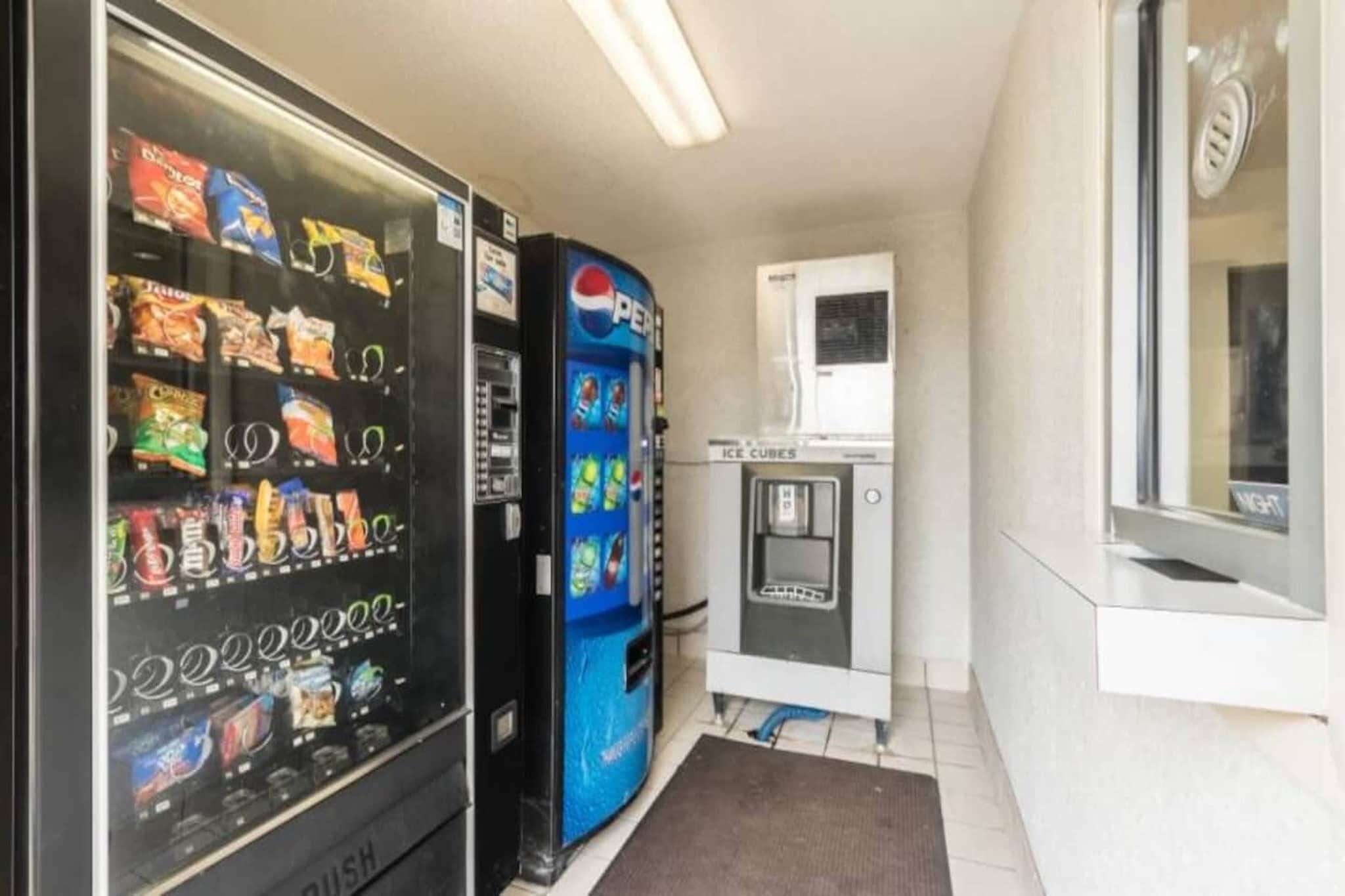 A vending area with snack and drink options, including a Pepsi machine.