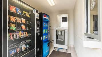 A vending area with snack and drink options, including a Pepsi machine.