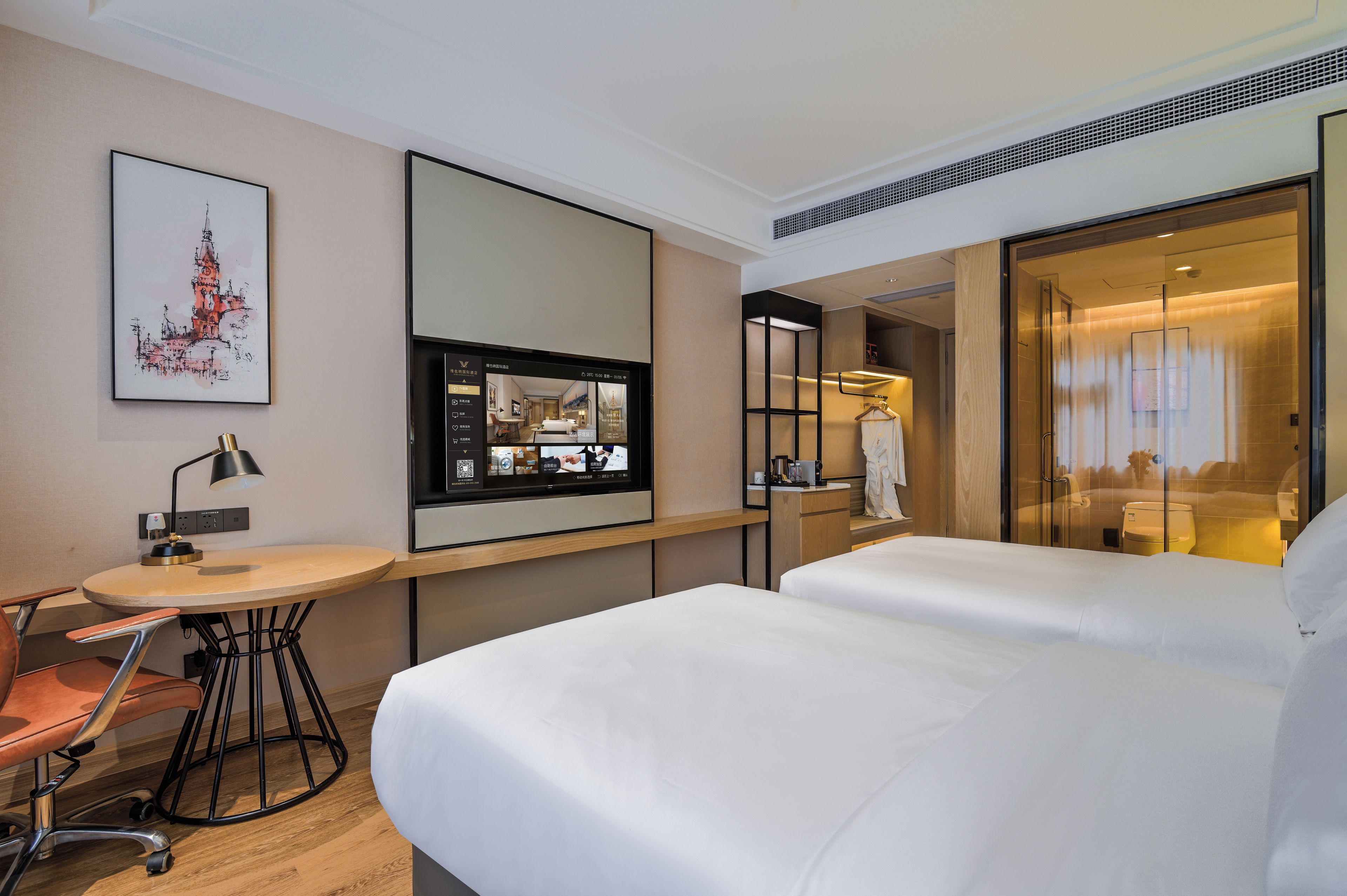 A hotel room with a bed, a desk with a chair, a flat-screen TV, and a painting on the wall.