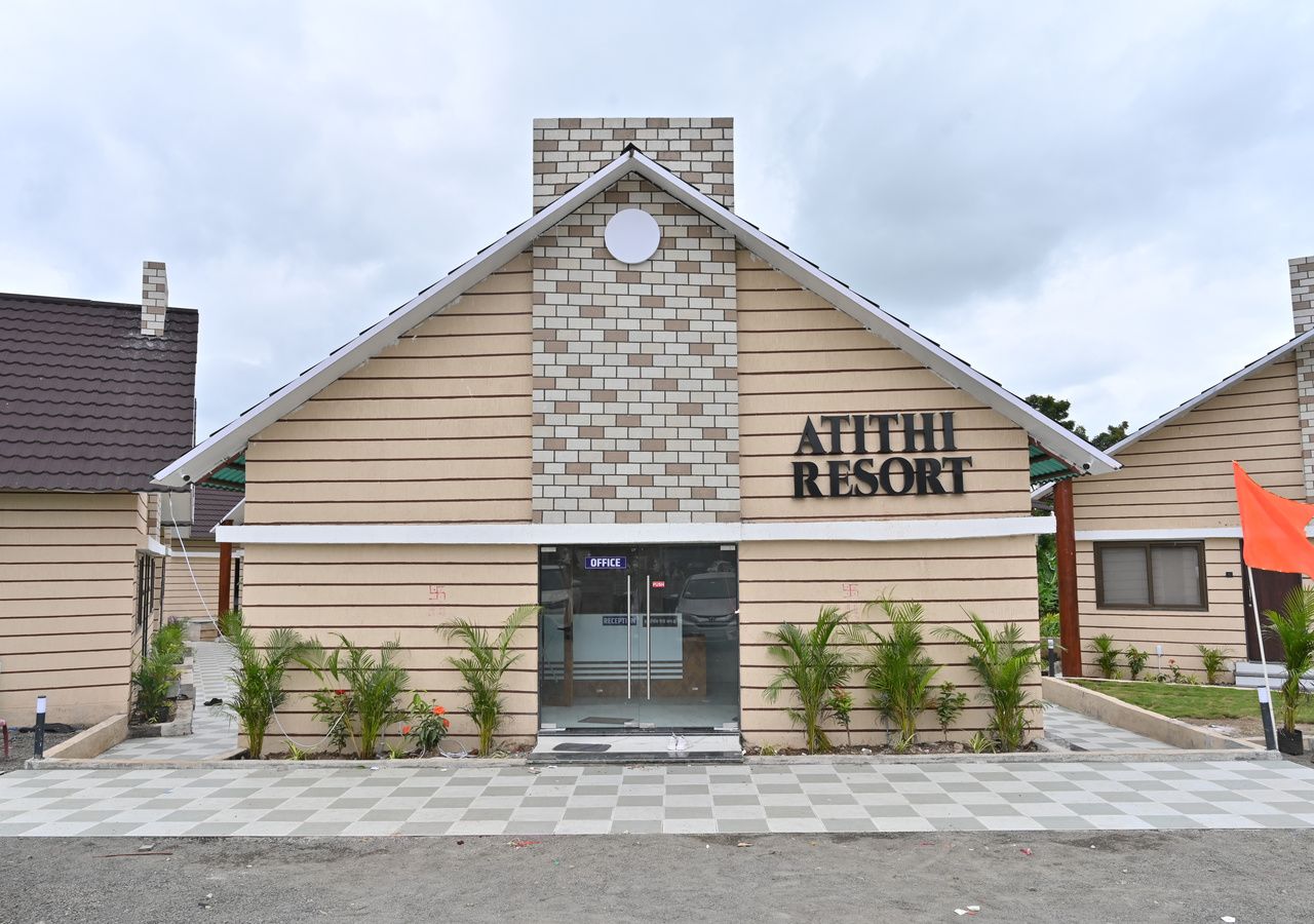 A building with a sign reading 'ATHLETIC RESORT' and a checkered pavement in front.