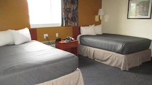 A hotel room with two beds, a desk, and a telephone. - 2 Full Beds|Smoking,Kitchen (Richmond VA)