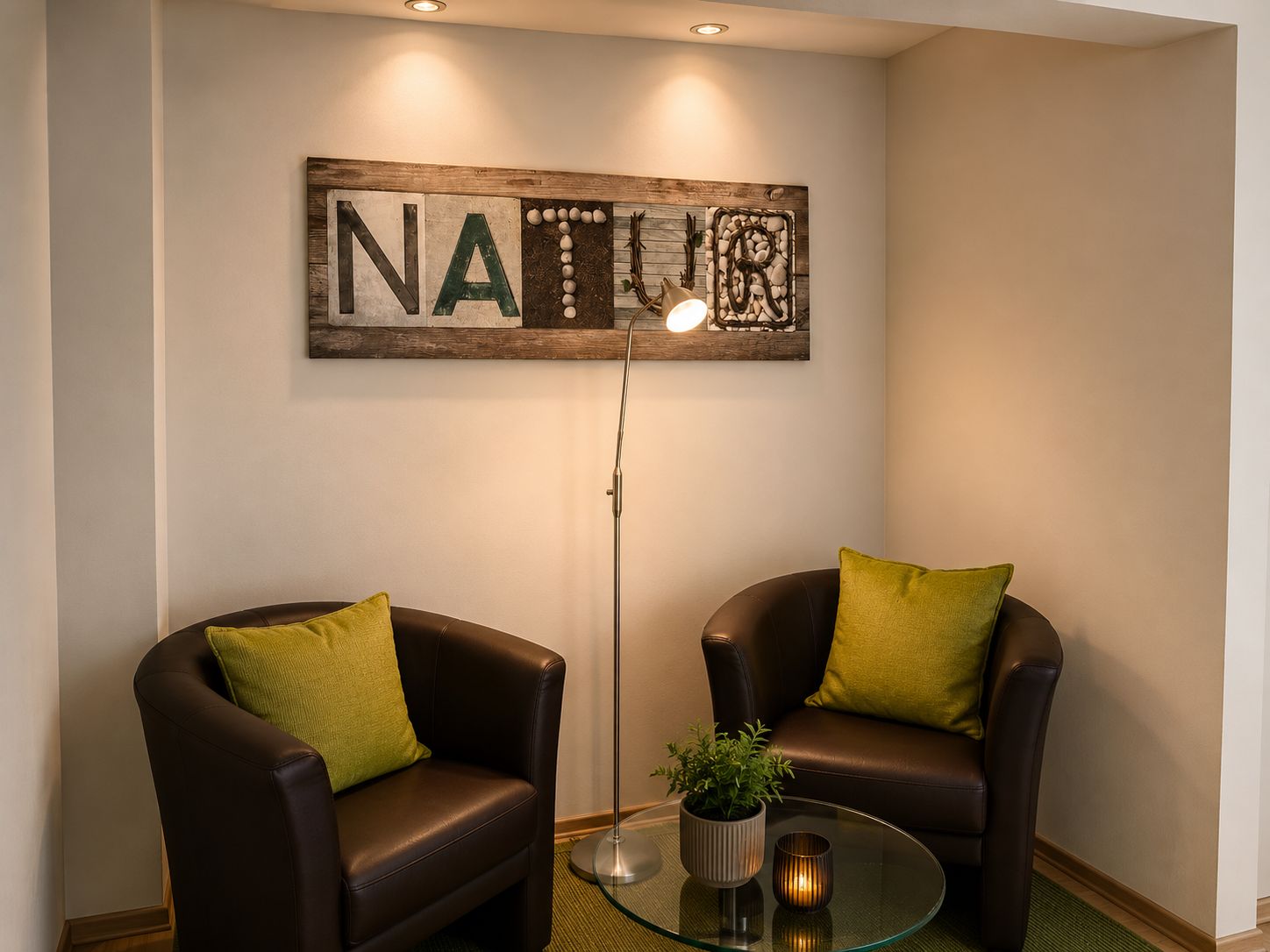 A room with two leather armchairs, a glass coffee table, a floor lamp, and a wall art piece with the letters 'NAT'.