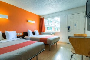 A hotel room with two beds, a desk, and a window with a view of buildings. - 2 Full Beds|Premium,Mini Fridge (Las Vegas)