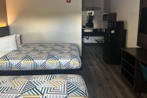 A hotel room with two beds, a kitchenette, and a small seating area. - 2 Full Beds | Premium, Mini Fridge (Kissimmee)