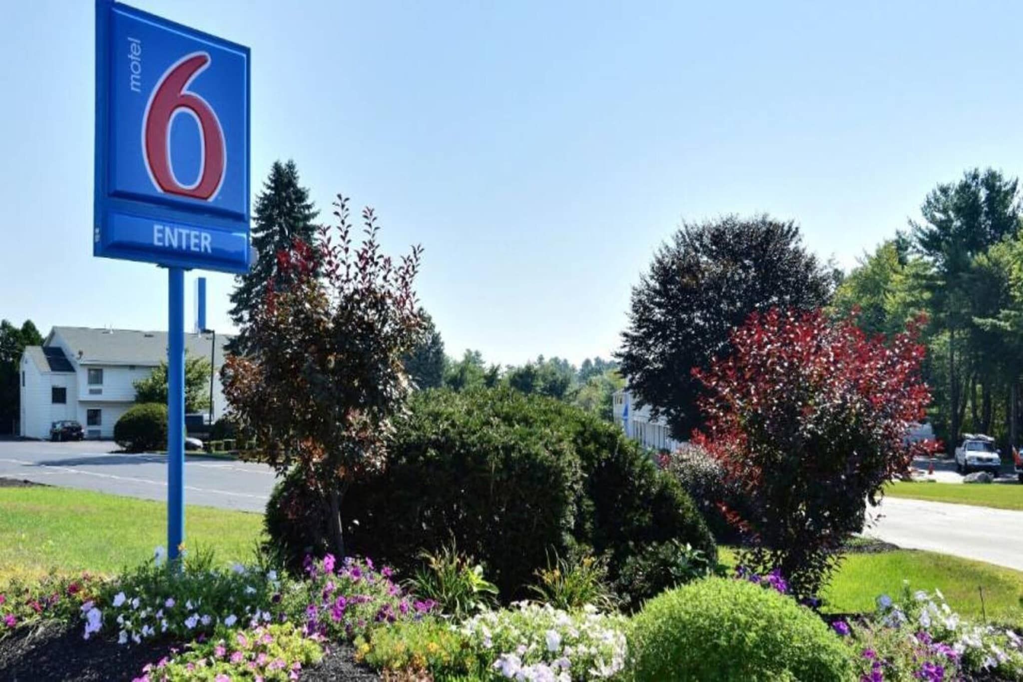 A motel sign with the number 6 and an 'ENTER' prompt.