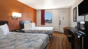 A hotel room with two beds, a desk, a chair, a television, and a window with a view. - 2 Queen Beds|Nsmk,Micfridge (Rolla)
