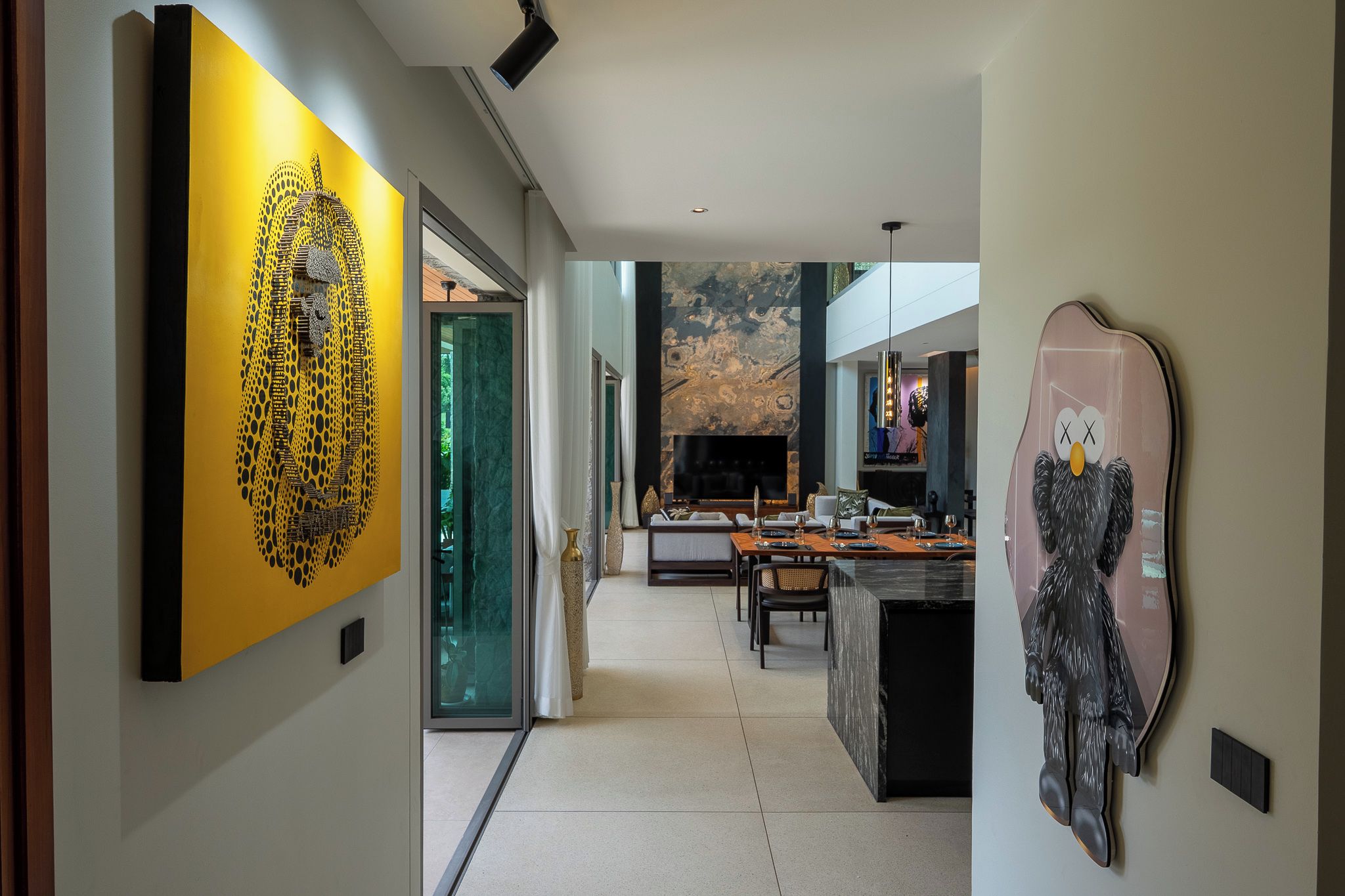 A modern interior with a dining area, kitchen, and living space.