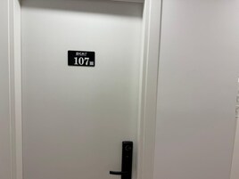 A door with a sign indicating room number 107.