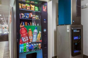 A vending machine with snacks and drinks, including G2 sodas and Tropicana juice.