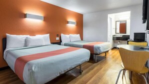 A hotel room with two beds, a desk, a chair, and a television. - Sunny 2-Bed Full Beds|Mini Fridge (Riverside)