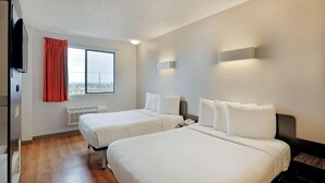 A hotel room with two beds, a window with a view, a flat-screen TV, and a red curtain. - 2 Queen Beds|Suite,Nsmk,Micfridge (Inglewood)