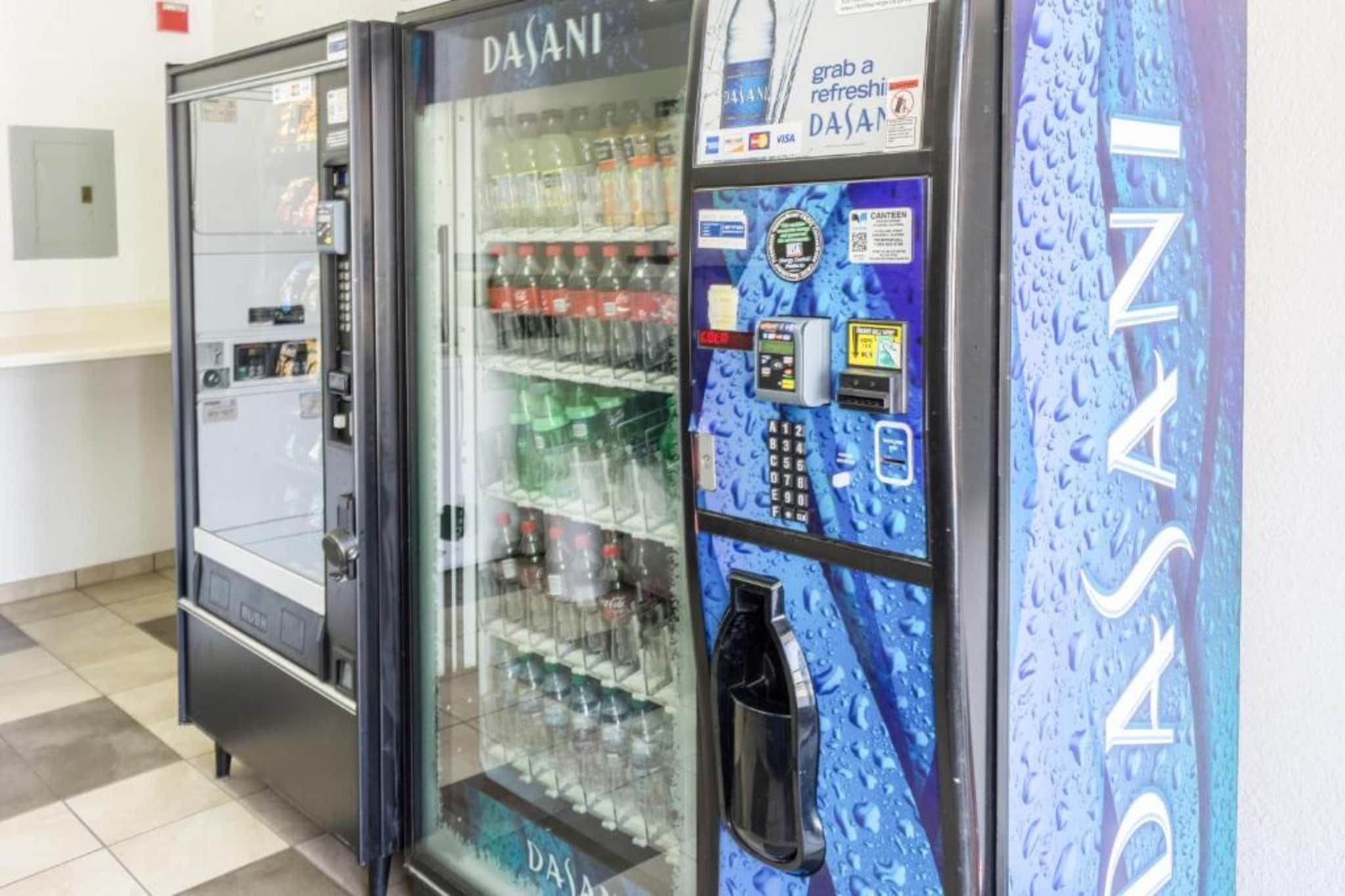 A vending machine with a water dispenser and a refrigerated beverage dispenser.