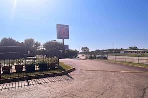 A parking lot with a large sign indicating a number 6.
