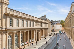 A historic building with classical architecture, large windows, and a central courtyard. - Stay Near Sorbonne & Luxembourg Garden (Paris)