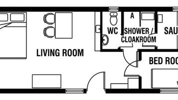 Un plan d’étage comprenant un salon, une salle de bain avec douche et toilettes, et une chambre.