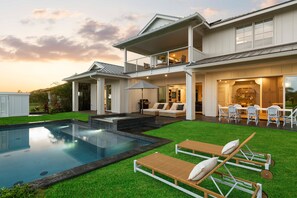 A two-story house with a swimming pool, outdoor seating, and a covered patio. - Hale Olina by Alekona Kauai (Koloa)