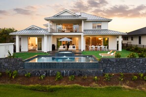 A two-story house with a swimming pool, a covered patio, and a well-maintained lawn. - Hale Olina by Alekona Kauai (Koloa)