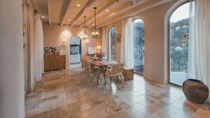 A spacious dining area with a high ceiling, large windows, and a view of the outdoors. - Qiran Rustic Resort Villa (Huairou)