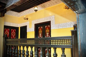 A staircase with ornate balustrades and decorative wall panels. - Palais Doha & SPA (Fes)