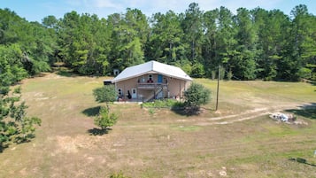 A single-story house with a front porch and a covered driveway.