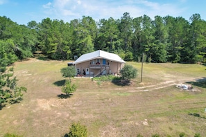 A single-story house with a front porch and a covered driveway.