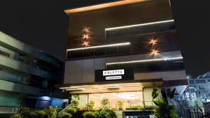A modern building with a sign reading 'PALETTE Company-Serviced'. - Palette Naveena Grand Hyderabad (Hyderabad)