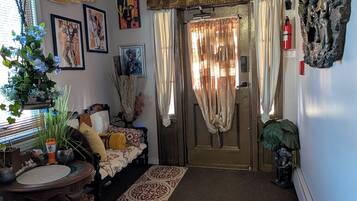 A cozy entryway with a bench, a rug, and a door marked 'EXIT'.
