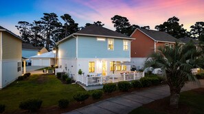 View of the rear of the home in the evening. - 3-Bedroom Home in the Heart of Myrtle Beach (Myrtle Beach)