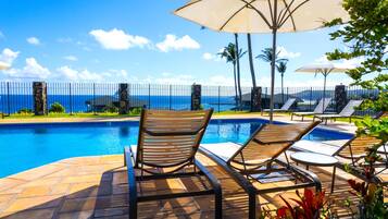 Take a break from exploring Maui and unwind in the peaceful pool area. Comfortable loungers and shade options ensure your perfect relaxation.