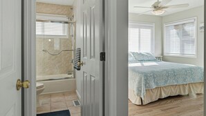 A bedroom with a bed, a ceiling fan, and a window with blinds. - Pet-Friendly, 5 min walk to beach & ferry (Ocean Beach)