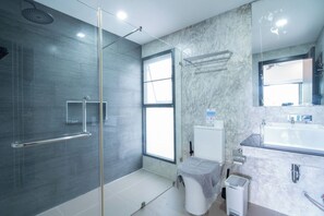 A modern bathroom with a glass shower enclosure, a large mirror, and a white sink. - Neau Melo Private Luxury Pool Villa (Ko Chang District)