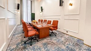 A conference room with a long table, multiple chairs, and a patterned carpet. - Arba Minch Conference Resort  (Arba Minch)